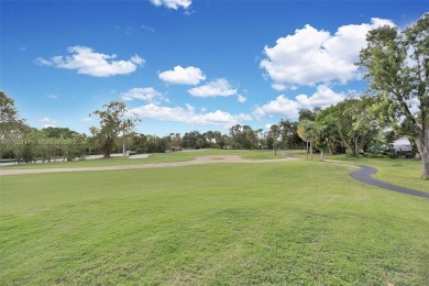 This gorgeous meticulously maintained split-bedroom home is on Woodmont Country Club in Florida - for sale on GolfHomes.com, golf home, golf lot