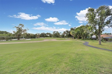 This gorgeous meticulously maintained split-bedroom home is on Woodmont Country Club in Florida - for sale on GolfHomes.com, golf home, golf lot