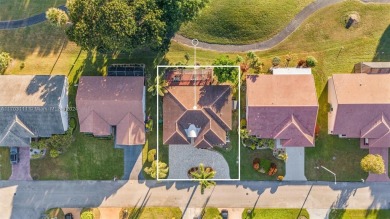 This gorgeous meticulously maintained split-bedroom home is on Woodmont Country Club in Florida - for sale on GolfHomes.com, golf home, golf lot