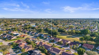 This gorgeous meticulously maintained split-bedroom home is on Woodmont Country Club in Florida - for sale on GolfHomes.com, golf home, golf lot