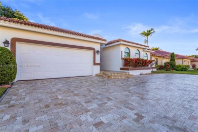 This gorgeous meticulously maintained split-bedroom home is on Woodmont Country Club in Florida - for sale on GolfHomes.com, golf home, golf lot