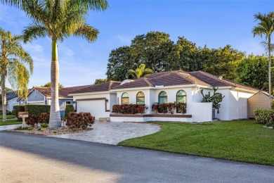 This gorgeous meticulously maintained split-bedroom home is on Woodmont Country Club in Florida - for sale on GolfHomes.com, golf home, golf lot