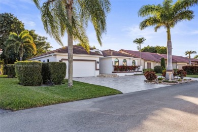 This gorgeous meticulously maintained split-bedroom home is on Woodmont Country Club in Florida - for sale on GolfHomes.com, golf home, golf lot