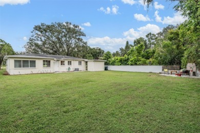 Charming Mid-Century Home with Golf Course Views! Nestled among on Babe Zaharias Golf Course in Florida - for sale on GolfHomes.com, golf home, golf lot