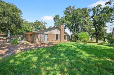 Perched on the tee box of the 14th hole of the beautiful Lake on Lake Kiowa Golf Course in Texas - for sale on GolfHomes.com, golf home, golf lot