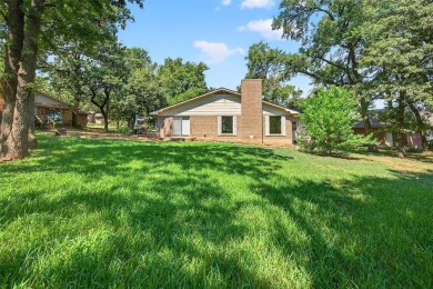 Perched on the tee box of the 14th hole of the beautiful Lake on Lake Kiowa Golf Course in Texas - for sale on GolfHomes.com, golf home, golf lot