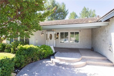 This beautiful home is nestled amidst gently rolling hills in on Vista Valencia Golf Course in California - for sale on GolfHomes.com, golf home, golf lot