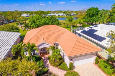 Enjoy breathtaking lake and golf course views from this on Monarch Country Club in Florida - for sale on GolfHomes.com, golf home, golf lot