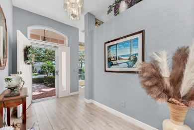 Enjoy breathtaking lake and golf course views from this on Monarch Country Club in Florida - for sale on GolfHomes.com, golf home, golf lot