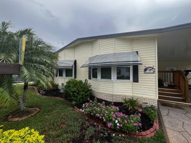 Welcome to this well-maintained 2-bedroom, 2-bath home offering on Lake Henry Golf Club in Florida - for sale on GolfHomes.com, golf home, golf lot