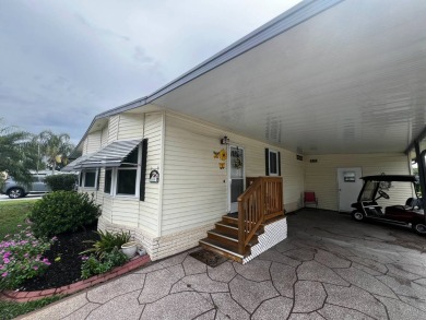 Welcome to this well-maintained 2-bedroom, 2-bath home offering on Lake Henry Golf Club in Florida - for sale on GolfHomes.com, golf home, golf lot