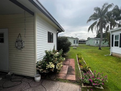 Welcome to this well-maintained 2-bedroom, 2-bath home offering on Lake Henry Golf Club in Florida - for sale on GolfHomes.com, golf home, golf lot