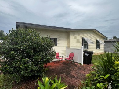 Welcome to this well-maintained 2-bedroom, 2-bath home offering on Lake Henry Golf Club in Florida - for sale on GolfHomes.com, golf home, golf lot