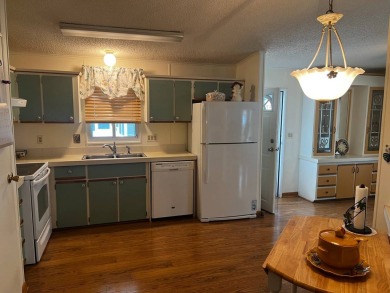 Welcome to this well-maintained 2-bedroom, 2-bath home offering on Lake Henry Golf Club in Florida - for sale on GolfHomes.com, golf home, golf lot