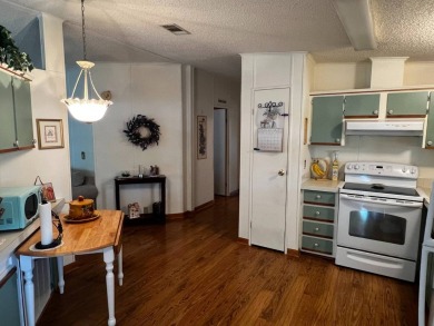 Welcome to this well-maintained 2-bedroom, 2-bath home offering on Lake Henry Golf Club in Florida - for sale on GolfHomes.com, golf home, golf lot