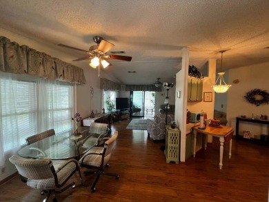 Welcome to this well-maintained 2-bedroom, 2-bath home offering on Lake Henry Golf Club in Florida - for sale on GolfHomes.com, golf home, golf lot