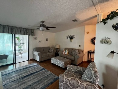 Welcome to this well-maintained 2-bedroom, 2-bath home offering on Lake Henry Golf Club in Florida - for sale on GolfHomes.com, golf home, golf lot