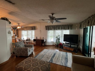 Welcome to this well-maintained 2-bedroom, 2-bath home offering on Lake Henry Golf Club in Florida - for sale on GolfHomes.com, golf home, golf lot