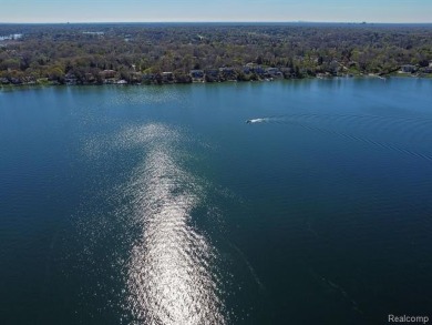 Welcome to your dream home on the shores of private all-sports on Pine Lake Country Club in Michigan - for sale on GolfHomes.com, golf home, golf lot