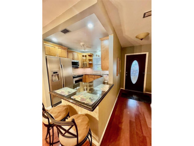Golf Course Views, Lake Tarpon Strolls, and Minutes to the on Tarpon Woods Golf Club in Florida - for sale on GolfHomes.com, golf home, golf lot