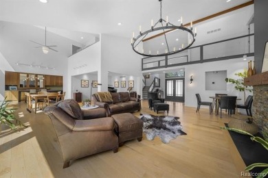 Welcome to your dream home on the shores of private all-sports on Pine Lake Country Club in Michigan - for sale on GolfHomes.com, golf home, golf lot