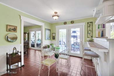 Tucked beneath the canopy of Southport's iconic old-growth oak on The Lakes Country Club in North Carolina - for sale on GolfHomes.com, golf home, golf lot