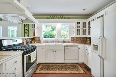 Tucked beneath the canopy of Southport's iconic old-growth oak on The Lakes Country Club in North Carolina - for sale on GolfHomes.com, golf home, golf lot