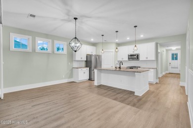 Welcome to 9246 Crossbill Dr. - a beautifully designed 4-bedroom on Cape Fear National At Brunswick Forest in North Carolina - for sale on GolfHomes.com, golf home, golf lot