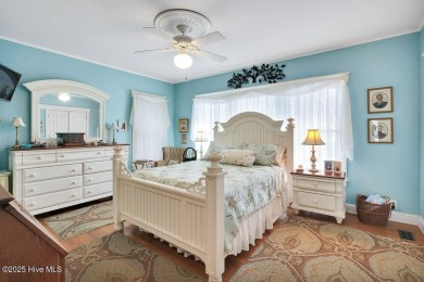 Tucked beneath the canopy of Southport's iconic old-growth oak on The Lakes Country Club in North Carolina - for sale on GolfHomes.com, golf home, golf lot