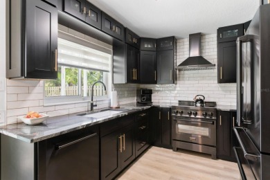 Welcome to true Florida indoor, outdoor, and community living on Hunters Green Country Club in Florida - for sale on GolfHomes.com, golf home, golf lot