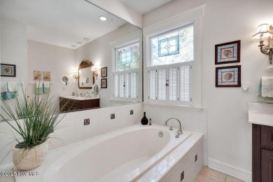 Tucked beneath the canopy of Southport's iconic old-growth oak on The Lakes Country Club in North Carolina - for sale on GolfHomes.com, golf home, golf lot