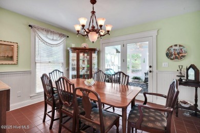 Tucked beneath the canopy of Southport's iconic old-growth oak on The Lakes Country Club in North Carolina - for sale on GolfHomes.com, golf home, golf lot