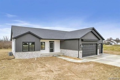 Home is currently being built with approximately 2-3 months on Copper Ridge Golf Club in Michigan - for sale on GolfHomes.com, golf home, golf lot