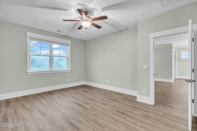 Welcome to 9246 Crossbill Dr. - a beautifully designed 4-bedroom on Cape Fear National At Brunswick Forest in North Carolina - for sale on GolfHomes.com, golf home, golf lot
