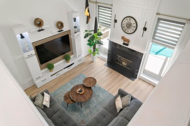 Welcome to true Florida indoor, outdoor, and community living on Hunters Green Country Club in Florida - for sale on GolfHomes.com, golf home, golf lot