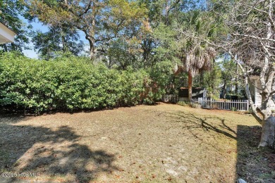 Tucked beneath the canopy of Southport's iconic old-growth oak on The Lakes Country Club in North Carolina - for sale on GolfHomes.com, golf home, golf lot