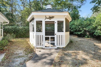 Tucked beneath the canopy of Southport's iconic old-growth oak on The Lakes Country Club in North Carolina - for sale on GolfHomes.com, golf home, golf lot