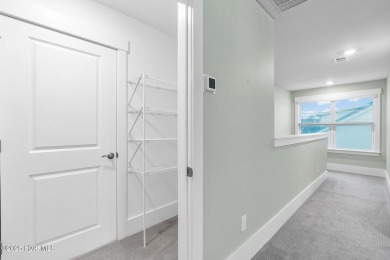 Welcome to 9246 Crossbill Dr. - a beautifully designed 4-bedroom on Cape Fear National At Brunswick Forest in North Carolina - for sale on GolfHomes.com, golf home, golf lot