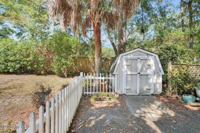 Tucked beneath the canopy of Southport's iconic old-growth oak on The Lakes Country Club in North Carolina - for sale on GolfHomes.com, golf home, golf lot