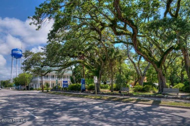 Tucked beneath the canopy of Southport's iconic old-growth oak on The Lakes Country Club in North Carolina - for sale on GolfHomes.com, golf home, golf lot