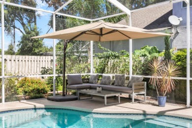 Welcome to true Florida indoor, outdoor, and community living on Hunters Green Country Club in Florida - for sale on GolfHomes.com, golf home, golf lot