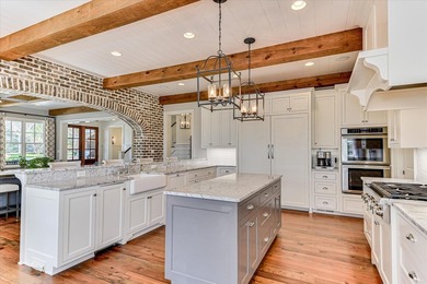 Welcome to 303 Founders Lane, an extraordinary luxury estate on Champions Retreat Golf Club in Georgia - for sale on GolfHomes.com, golf home, golf lot