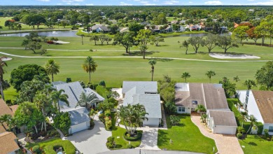 In the heart of Palm Beach Gardens this beautifully updated on Old Marsh Golf Club in Florida - for sale on GolfHomes.com, golf home, golf lot