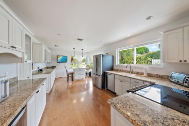 In the heart of Palm Beach Gardens this beautifully updated on Old Marsh Golf Club in Florida - for sale on GolfHomes.com, golf home, golf lot