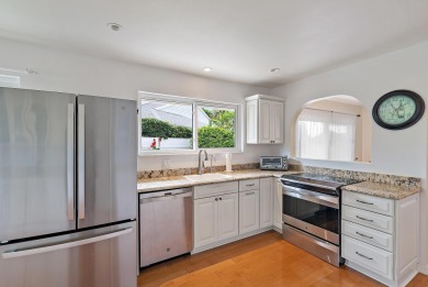 In the heart of Palm Beach Gardens this beautifully updated on Old Marsh Golf Club in Florida - for sale on GolfHomes.com, golf home, golf lot