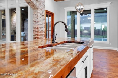 Discover luxury living at its finest in this custom home located on LeTriomphe Golf and Country Club in Louisiana - for sale on GolfHomes.com, golf home, golf lot