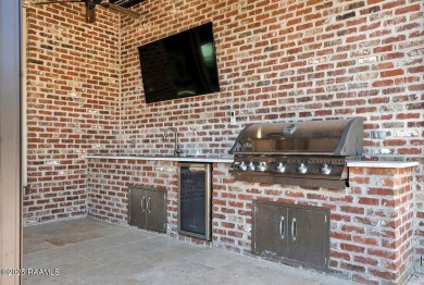 Discover luxury living at its finest in this custom home located on LeTriomphe Golf and Country Club in Louisiana - for sale on GolfHomes.com, golf home, golf lot