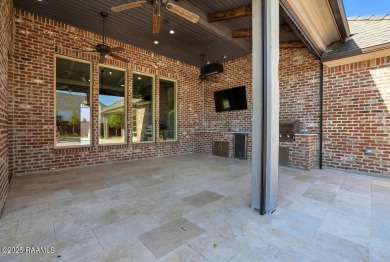 Discover luxury living at its finest in this custom home located on LeTriomphe Golf and Country Club in Louisiana - for sale on GolfHomes.com, golf home, golf lot