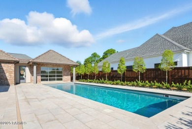 Discover luxury living at its finest in this custom home located on LeTriomphe Golf and Country Club in Louisiana - for sale on GolfHomes.com, golf home, golf lot