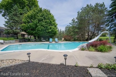 Exceptional 4-bedroom, 3.2-bath. Home in a park-like setting on Fern Hill Country Club in Michigan - for sale on GolfHomes.com, golf home, golf lot